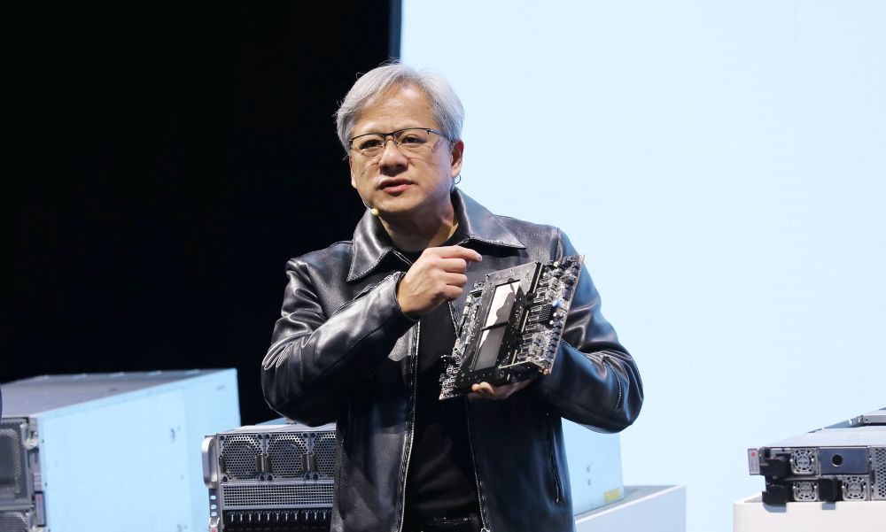 Nvidia CEO Jensen Huang presenting a next-generation AI chip on stage at GTC 2025.